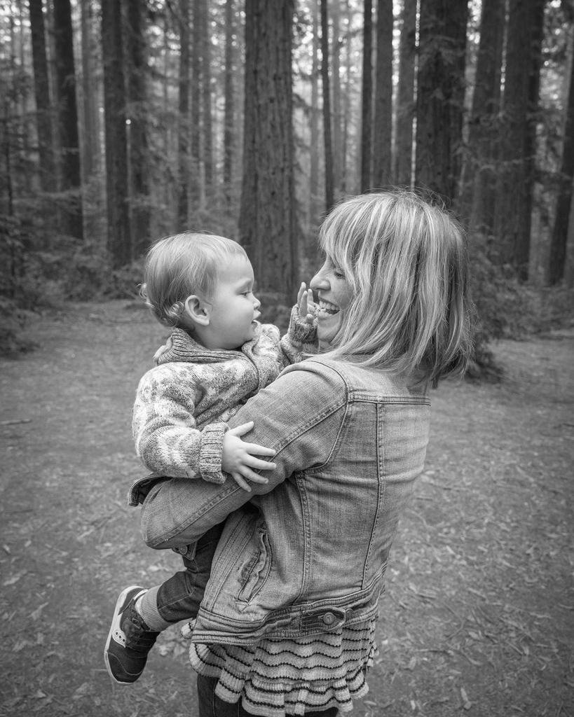 Mother holding baby during Redwood Oakland Park family session