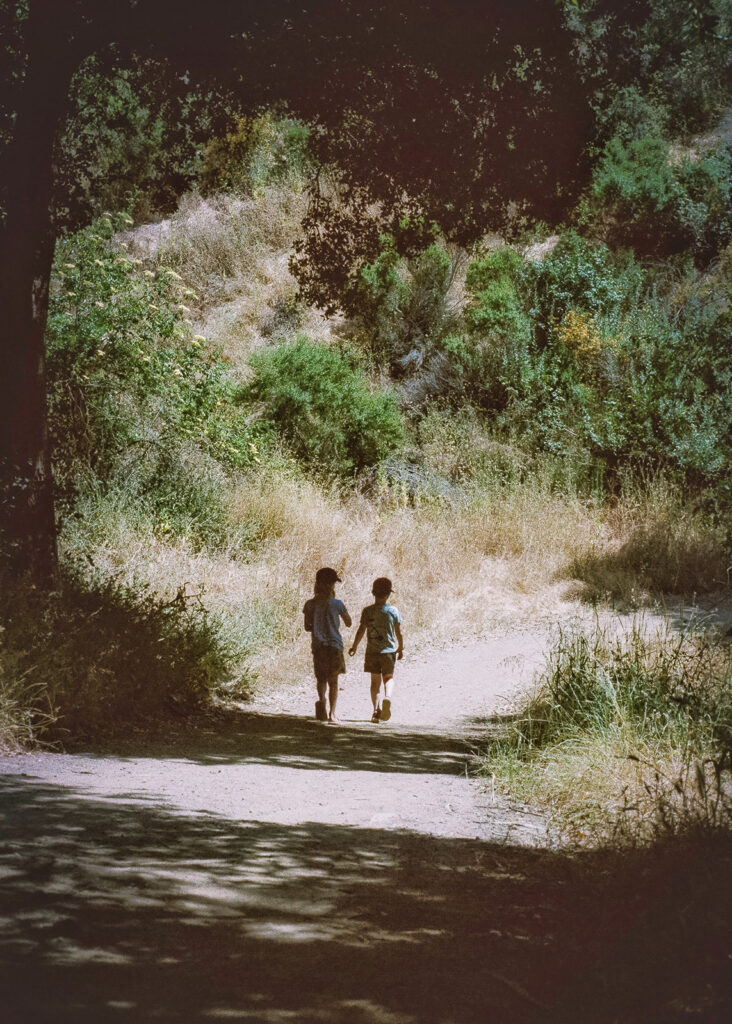 Kids walking down dirt path