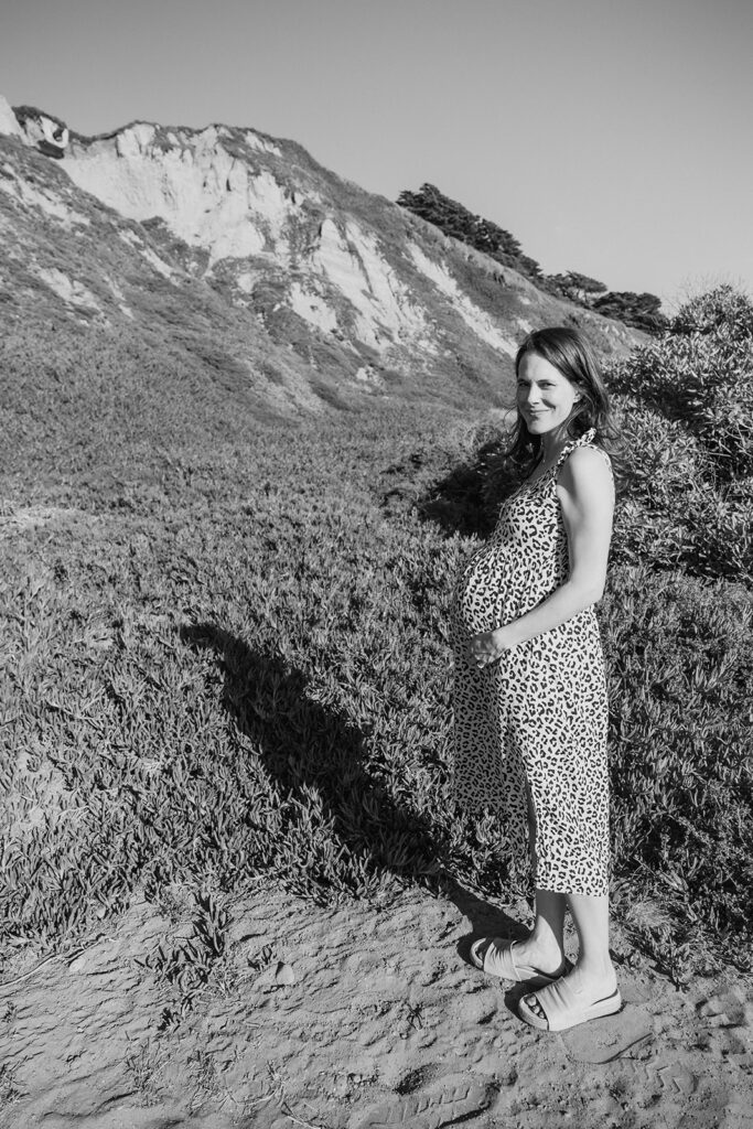 Pregnant woman posing on the beach