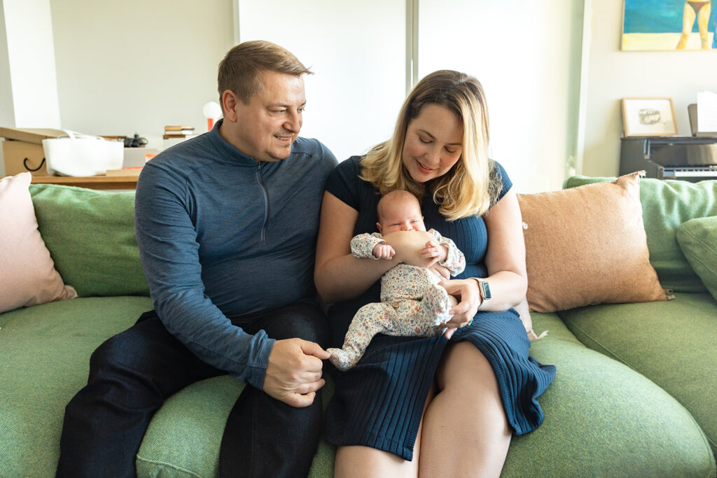 Mother and father with baby during At Home newborn photos in Berkeley, California