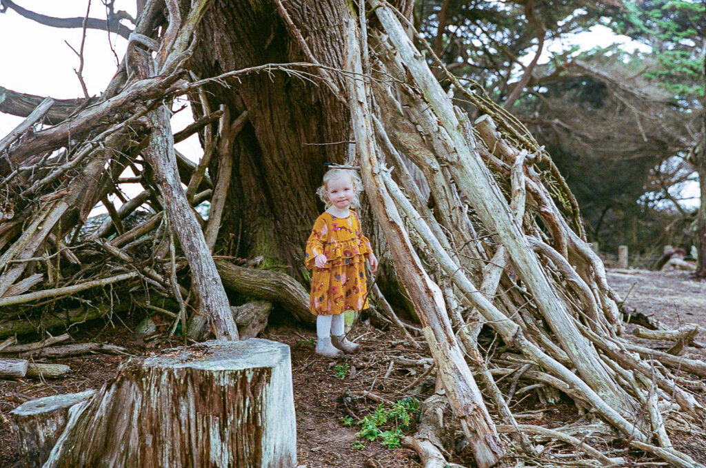 Little girl playing outdoors on 35mm film