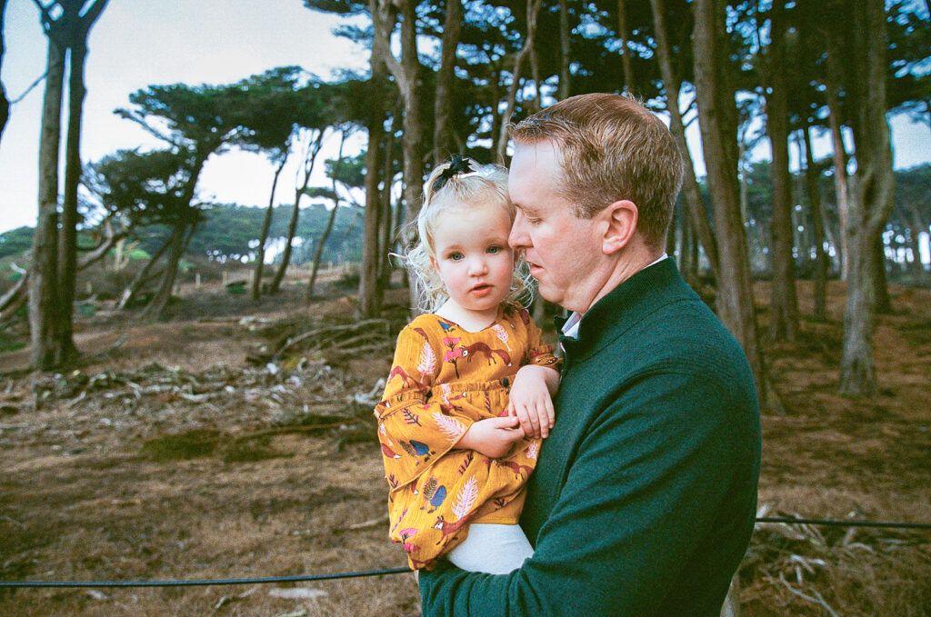 Father holding daughter on 35mm film