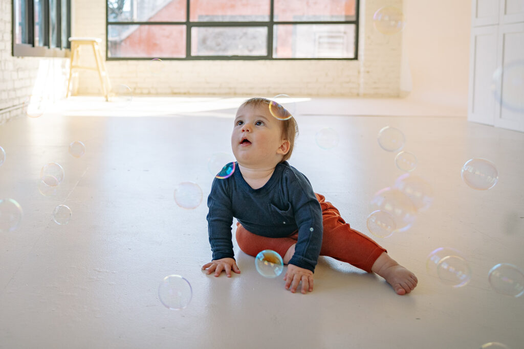 Baby admiring bubbles