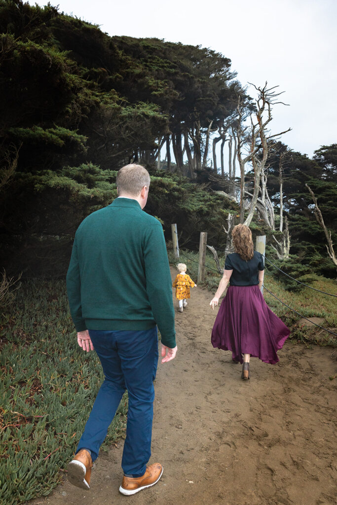 Family of three walking a SF trail