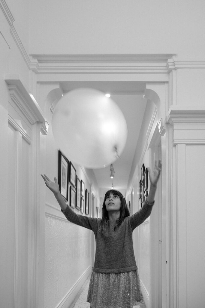 Girl playing with a baloon