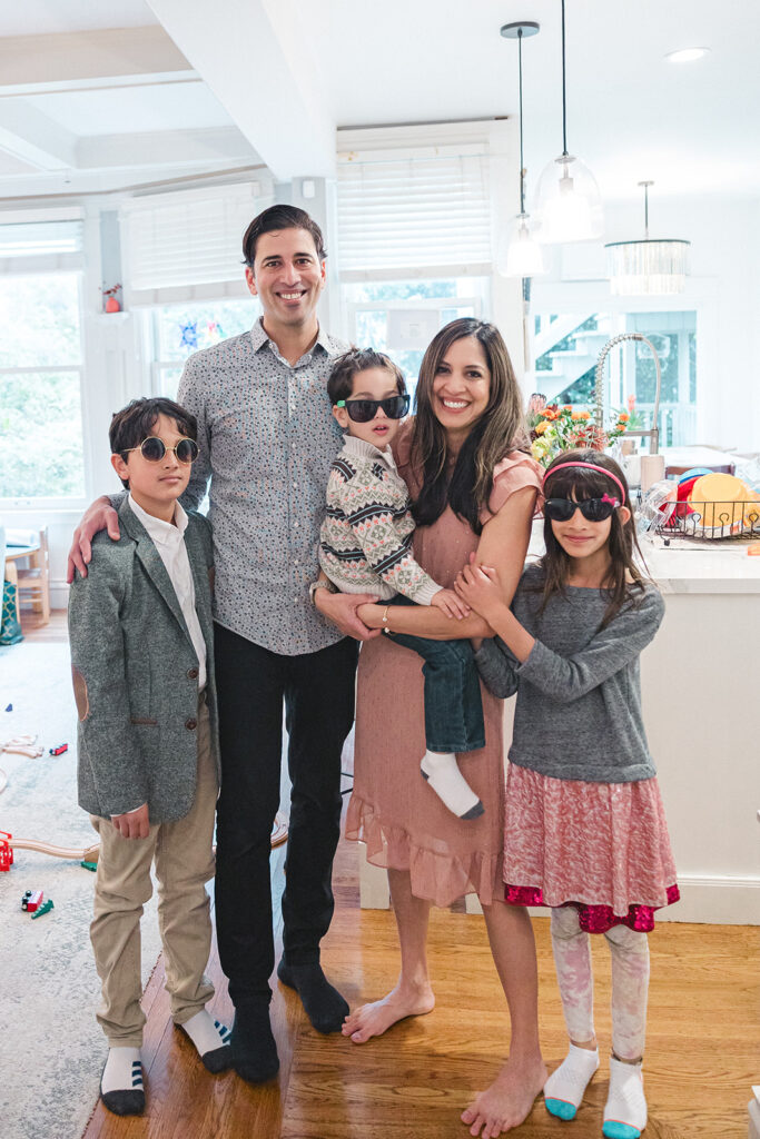 Family of five posing for photos during their at home photoshoot in San Francisco