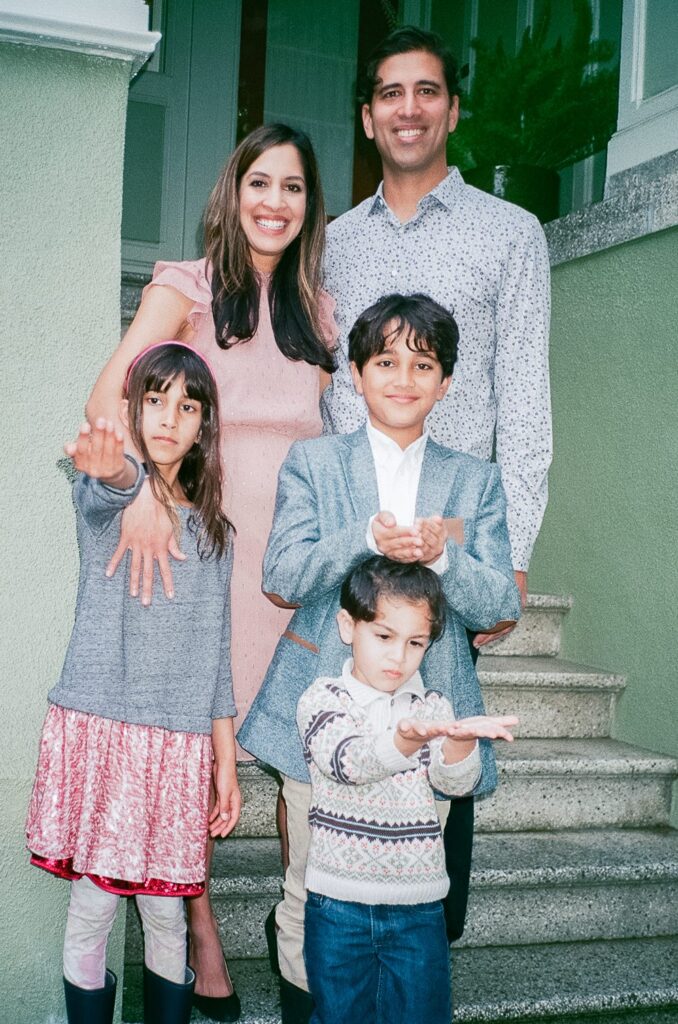 Family standing outside of their house for a family photoshoot in San Francisco on 35mm film