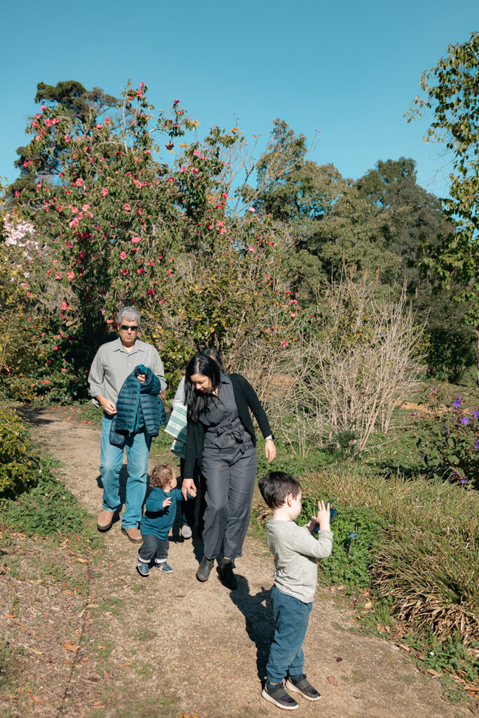 Family walking in the San Francisco Botanical Gardens during their family photo session