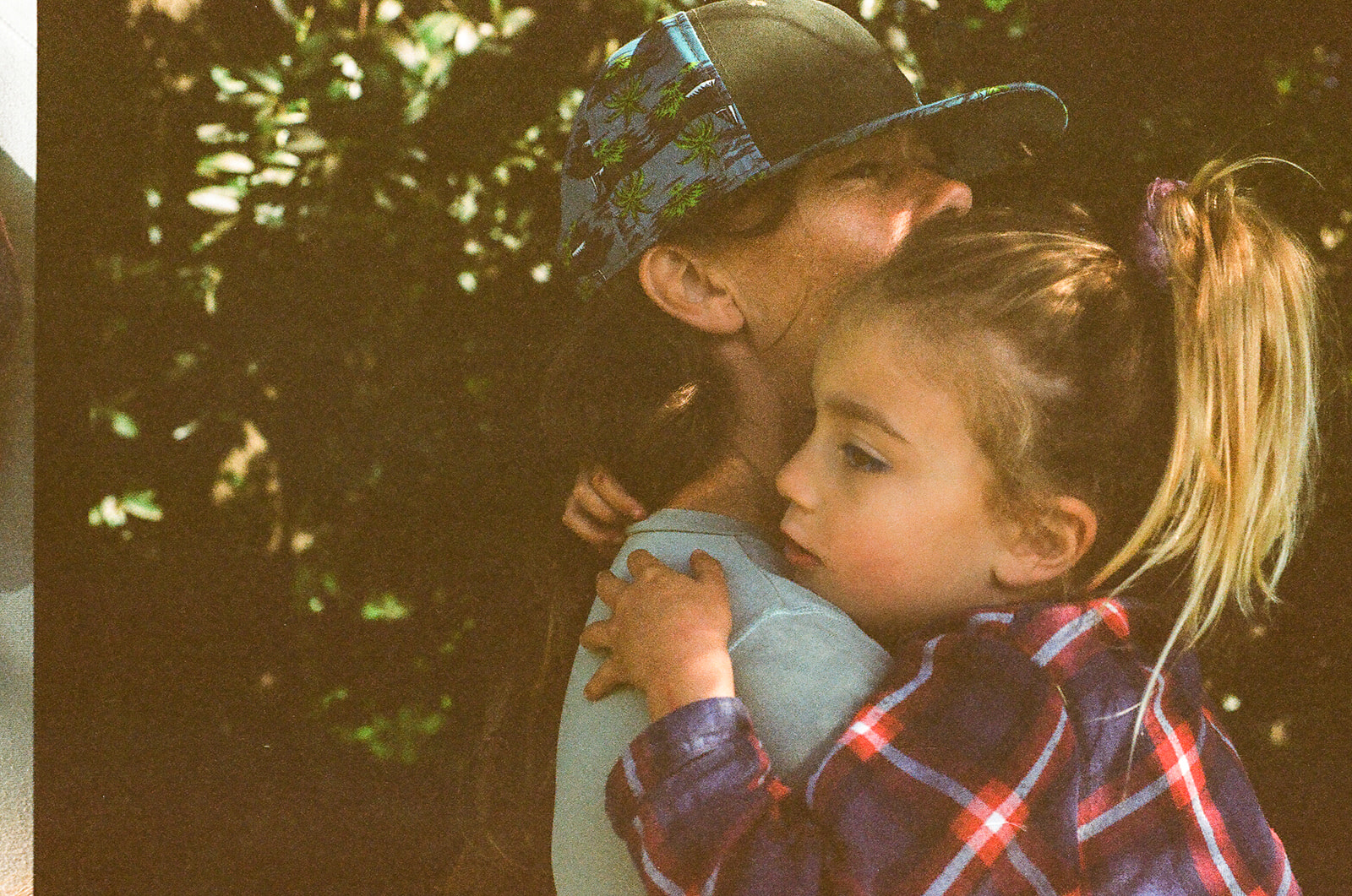 Mother holding daughter on 35mm dilm