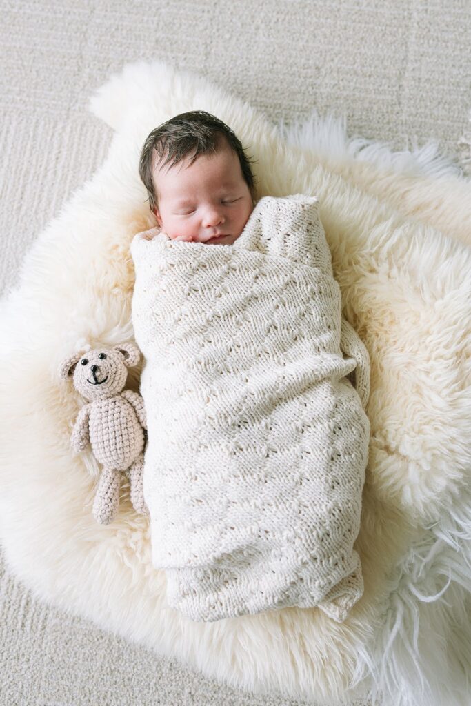 Baby wrapped in blanket during at home newborn session in the Bay Area