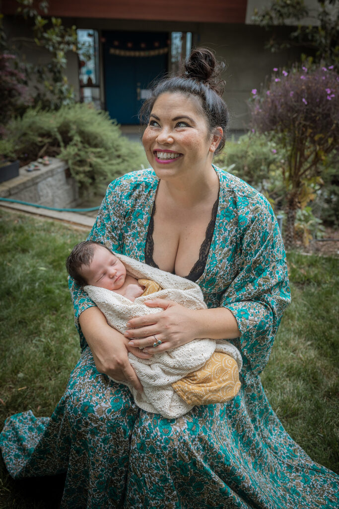 Mother holding her newborn daughter