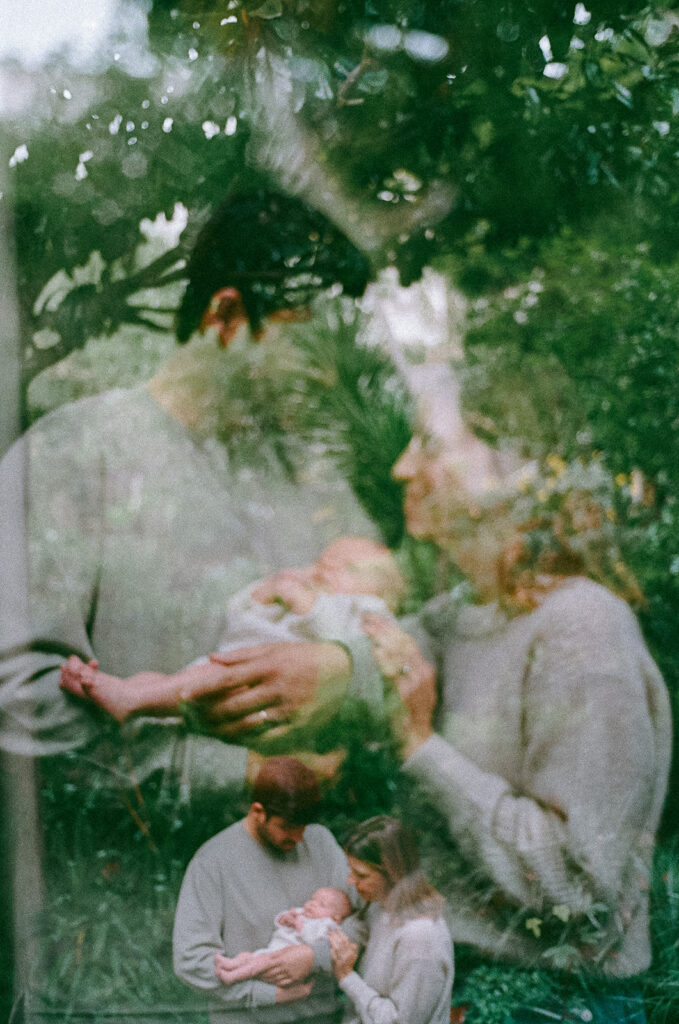 Double exposure photo of a family of three outside during their San Francisco newborn photoshoot captured on 35mm film