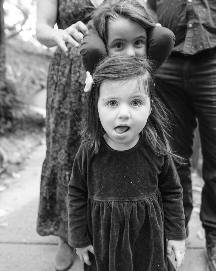 Black and white photo of two young girls during their families photoshoot 