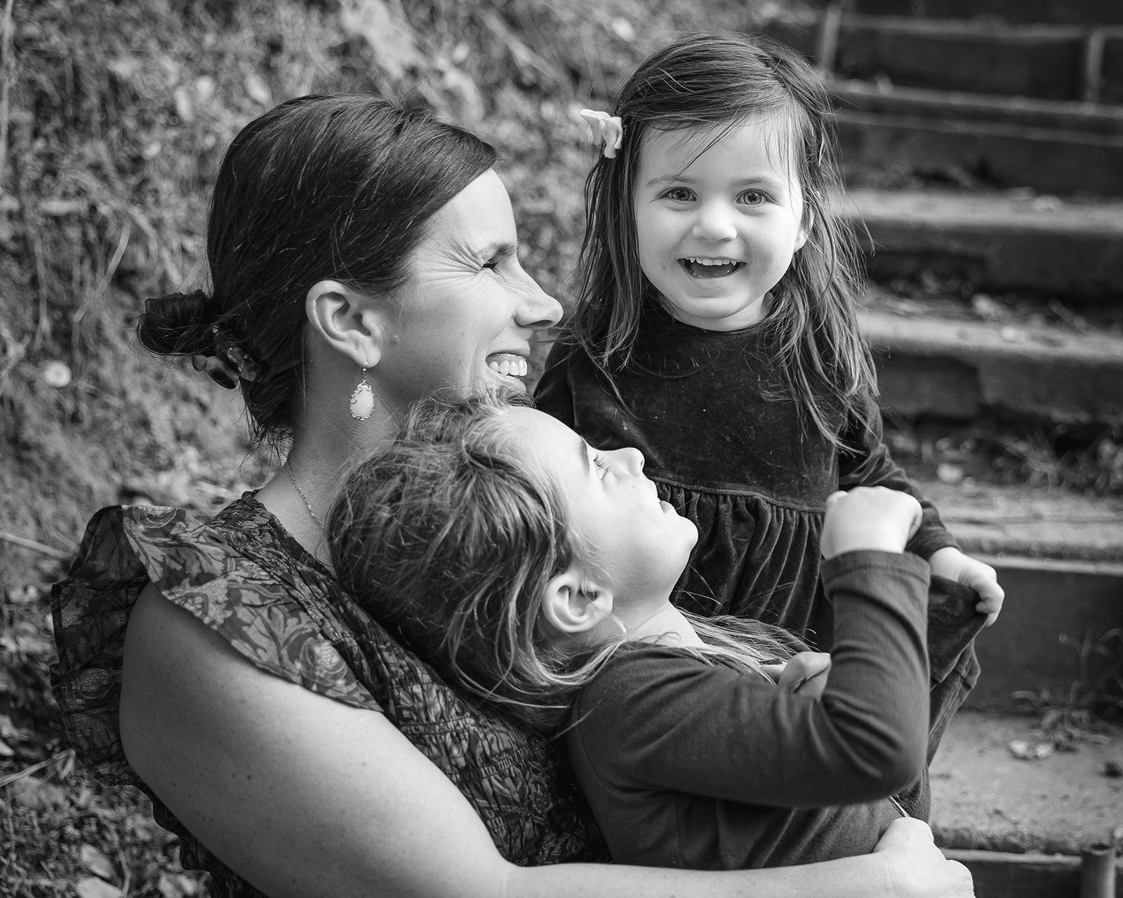 Black and white photo of a mother and her two daughters
