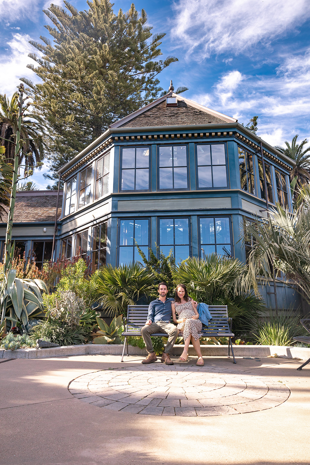 Man and woman sitting on a bench at Sunnyside Conservatory in San Francisco