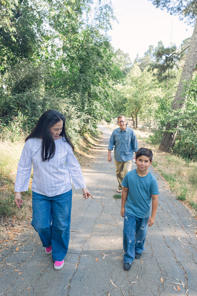 Family of three walking the trails at Sibley Regional Park for their Oakland CA family photos