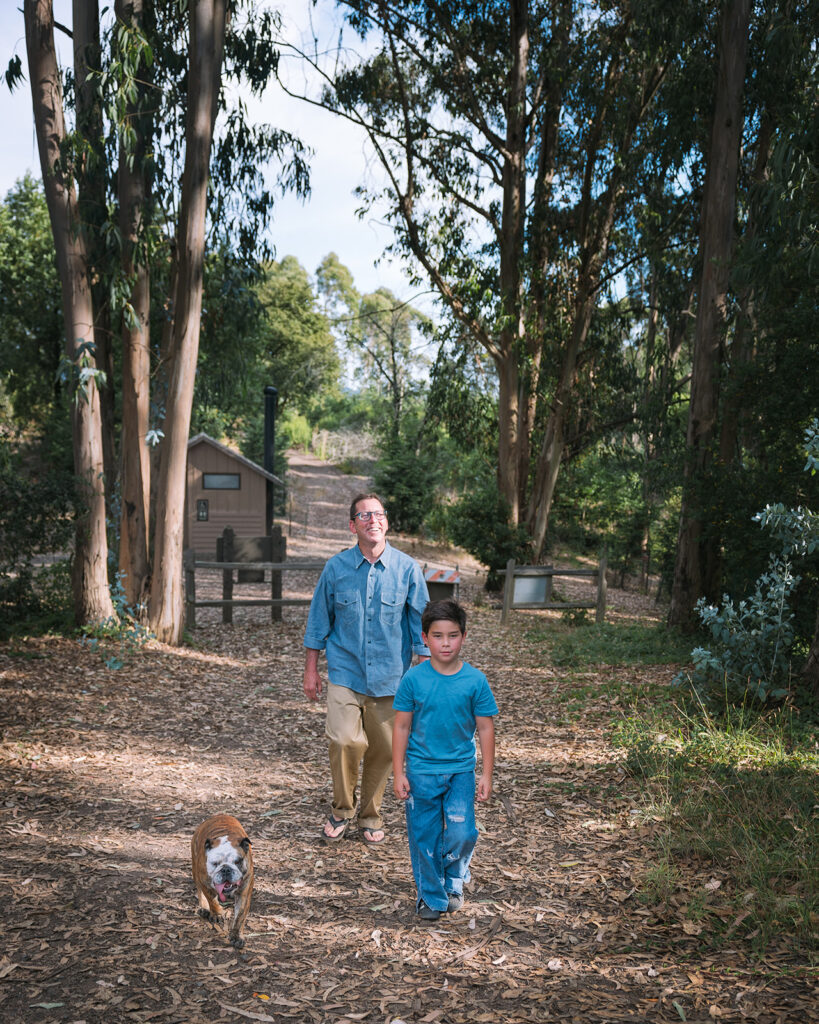 Father, son and their dog walking the trails at Sibley Regional Park in Oakland, CA