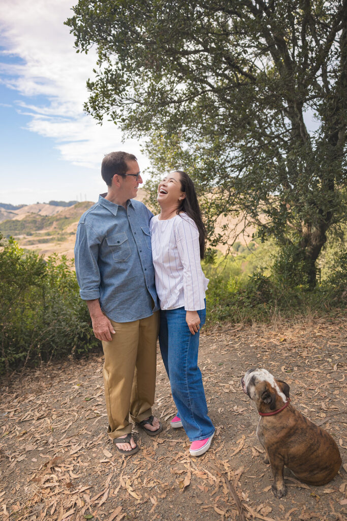 Mna, woman and their dog enjoying the views at Sibley Regional Park for their Oakland CA family photos