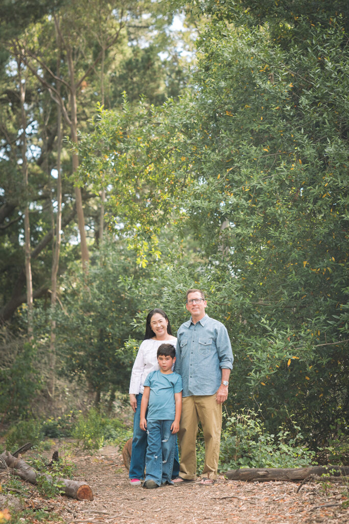 Family of three posing for their Oakland CA family photos at Sibley Regional Park