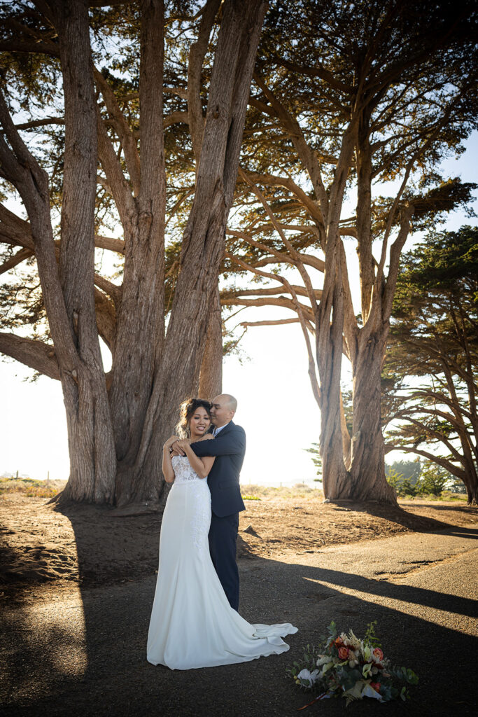 Couple walking along the Cypress Tree Tunnel for their intimate Point Reyes elopement in Northern California