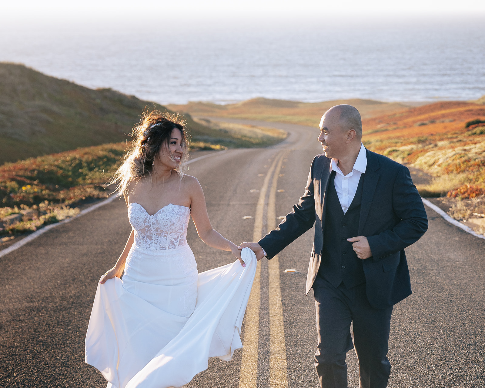 Couple walking along the road in Point Reyes for their intimate elopement in Northern California