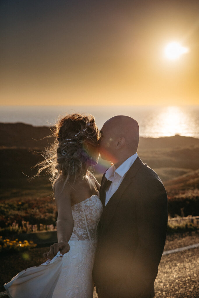 Couple admiring the sunset at Point Reyes during their intimate elopement in Northern California