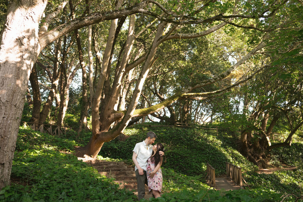 Man and woman posing for their East Bay maternity photography session at Berkeley Rose Garden