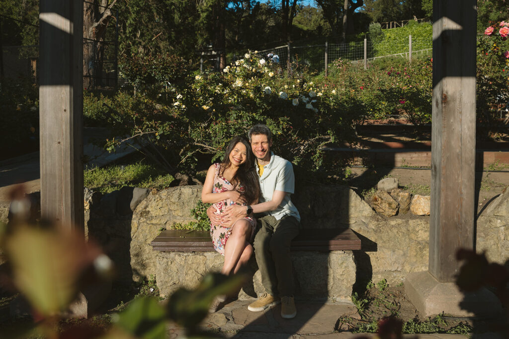 Pregnant woman and man sitting at a Berkeley Park