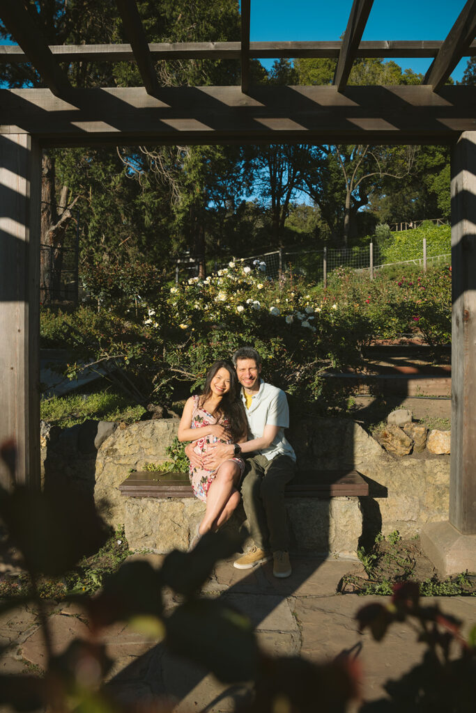 Pregnant woman and man sitting at a Berkeley Park