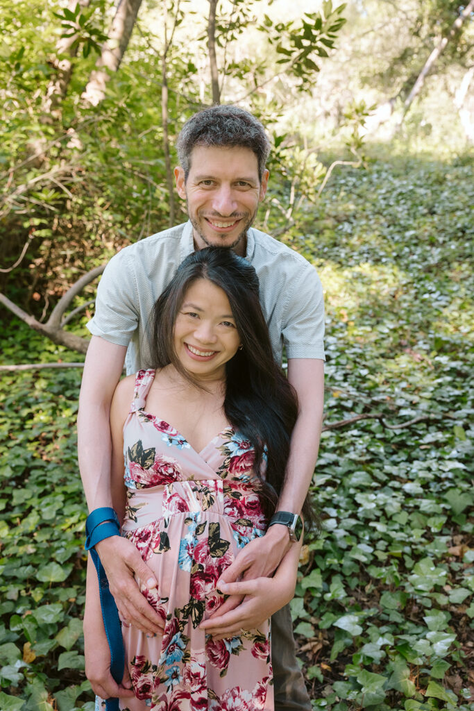 Man holding his pregnant partners belly during their East Bay maternity photography session