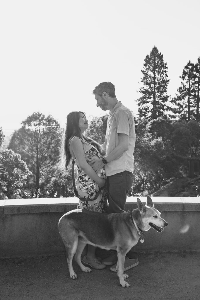 Black and white photo of a man, woman and their dog at a Berkeley Park