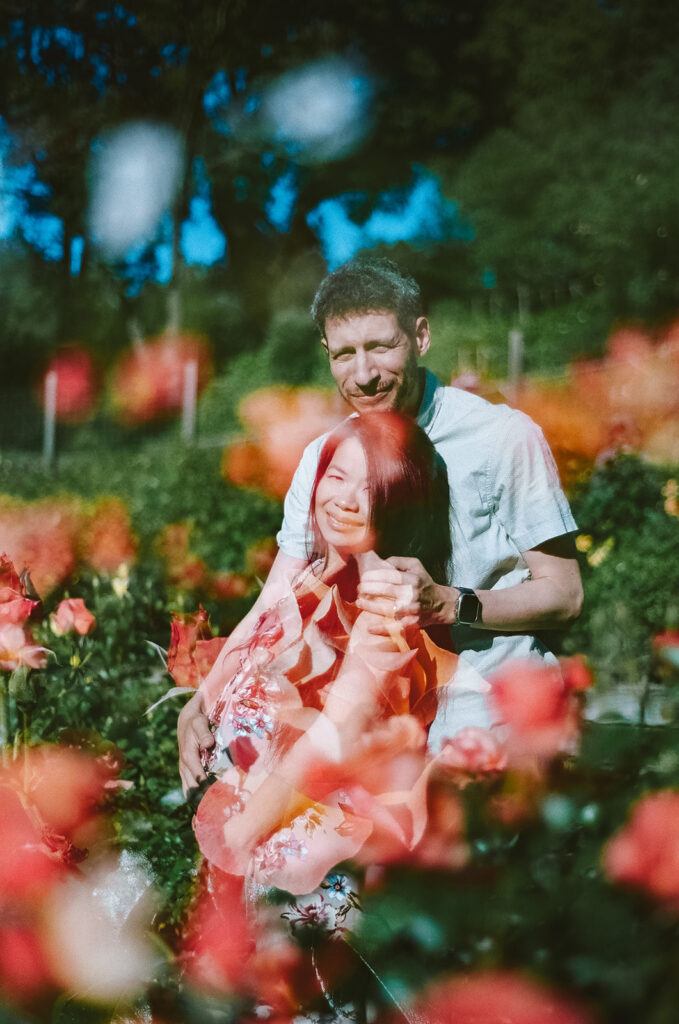 Double exposure image of a couple and their dog at a Berkeley Rose Garden for their East Bay maternity photography session captured on 35mm film