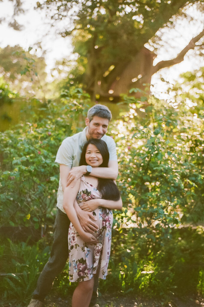 Man and woman posing for photos in Berkeley captured on 35mm film