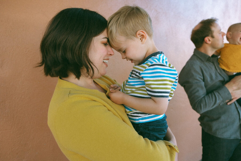 Mother holding her toddler son during their East Bay mini sessions