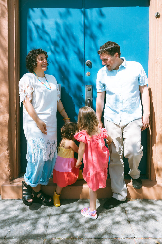 Family of four posing for their East Bay mini session at Morningtide shop in Albany, CA