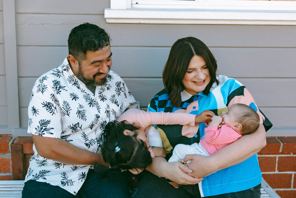 Family of four posing for photos