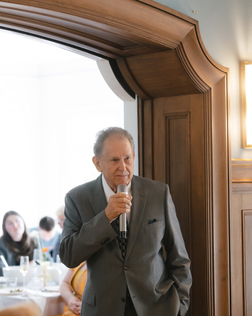 Father of the bride giving a speech at the wedding reception