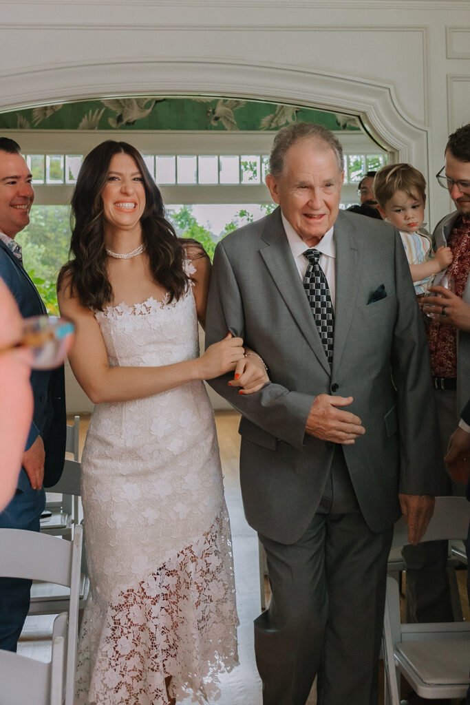 Bride getting emotional as she's being walked down the aisle by her father