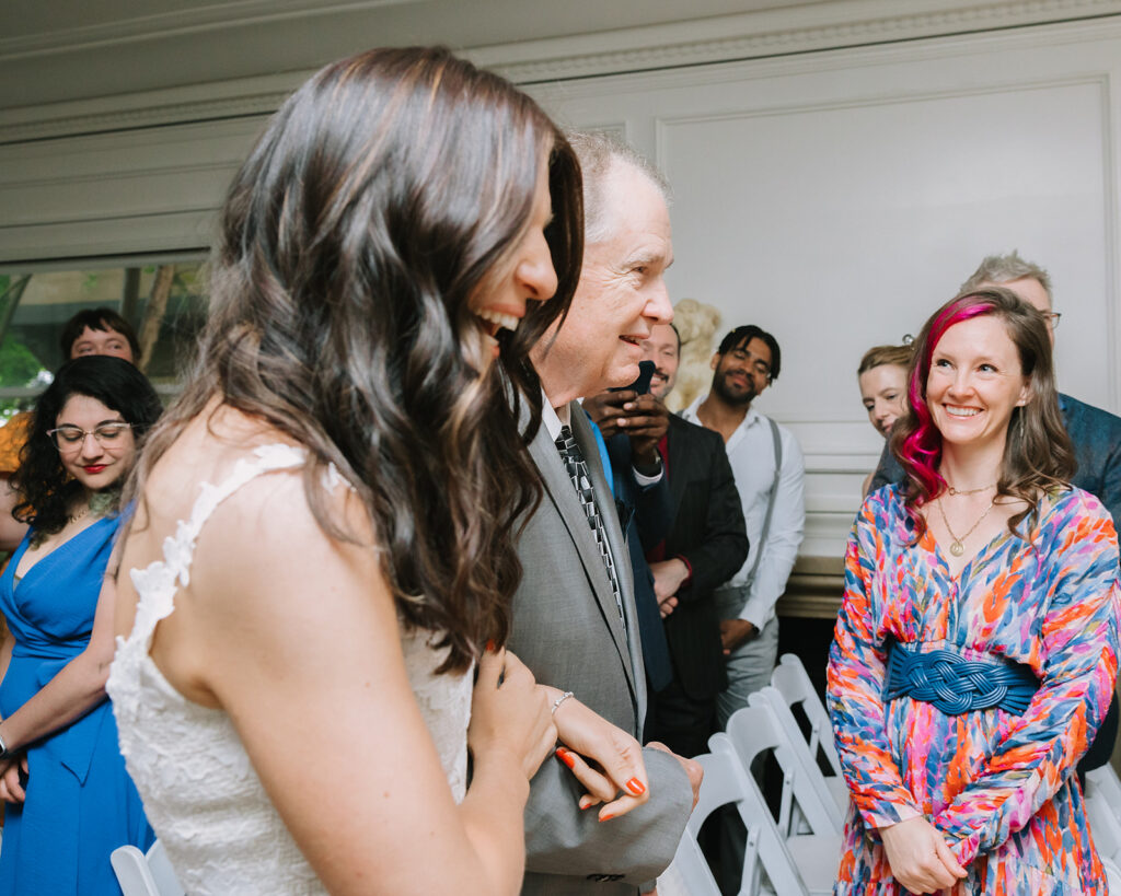 Bride being walked down the aisle by her father