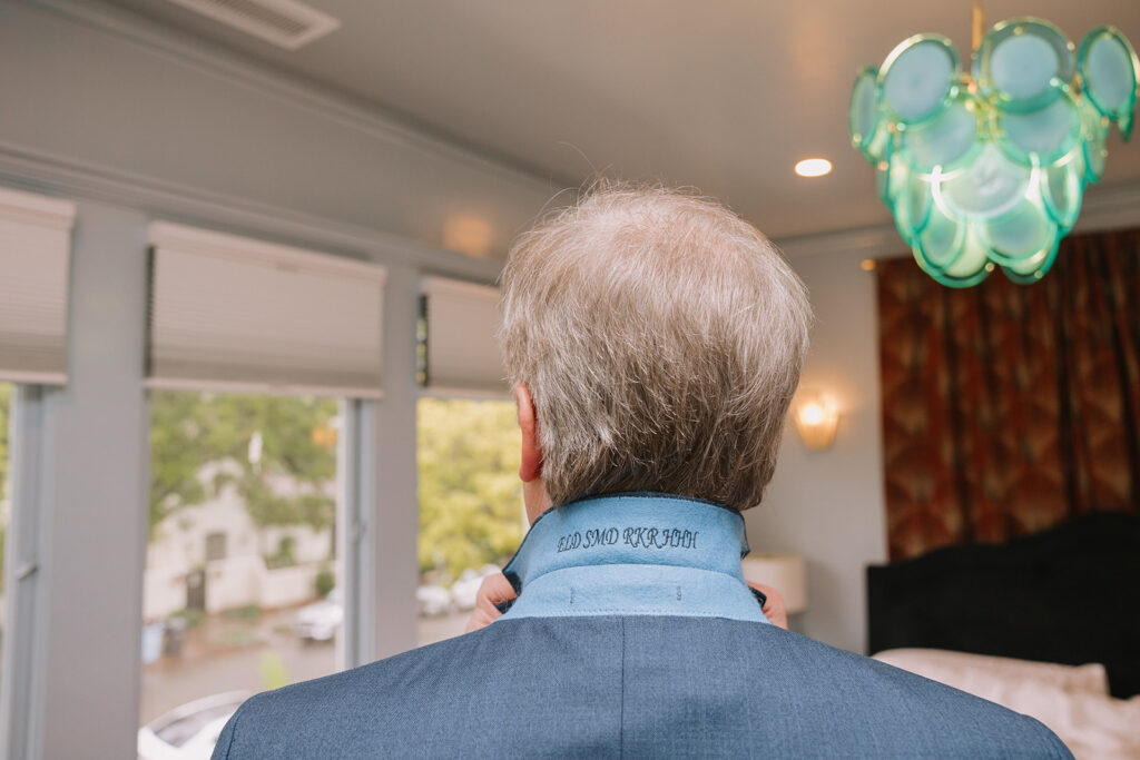 Groom getting ready for his intimate at-home East Bay wedding in Berkeley, California