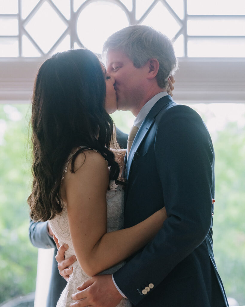 Bride and groom kissing after their intimate at-home East Bay wedding ceremony in Berkeley, California