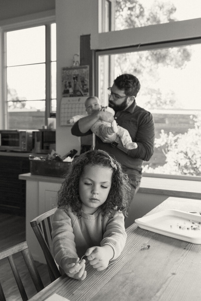 Black and white photo of documentary family photos in their kitchen