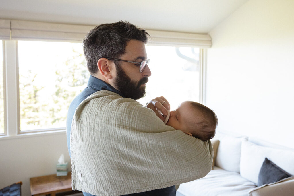 Father holing his newborn