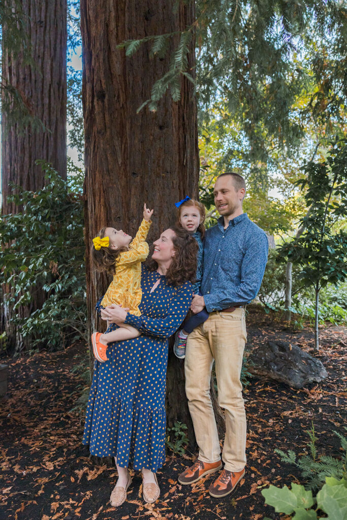 Family of four posing for their outdoor family photos at Piedmont Park in the East Bay of California