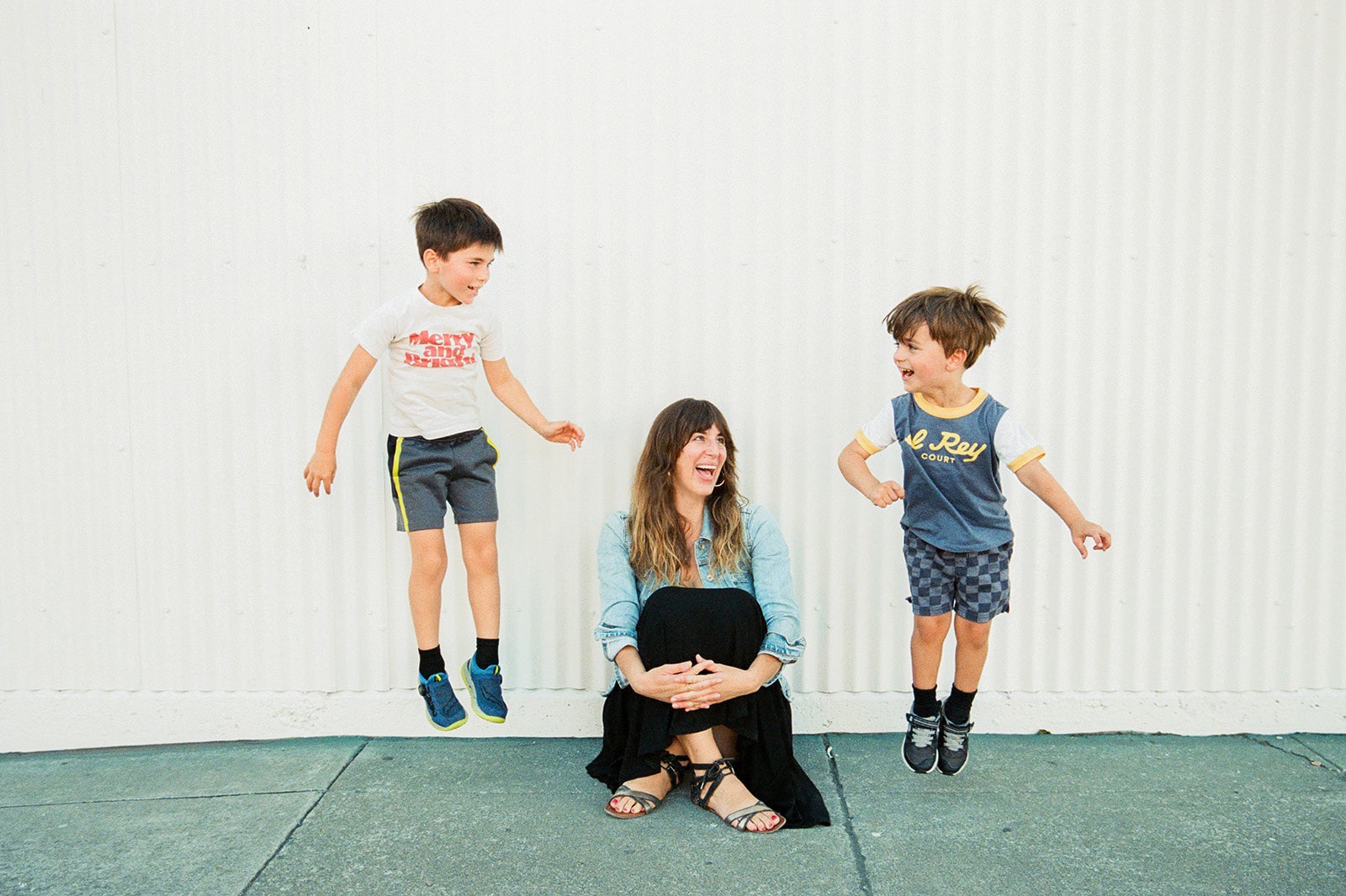 Laura Jaeger, a San Francisco family photographer and her two sons posing for a photo