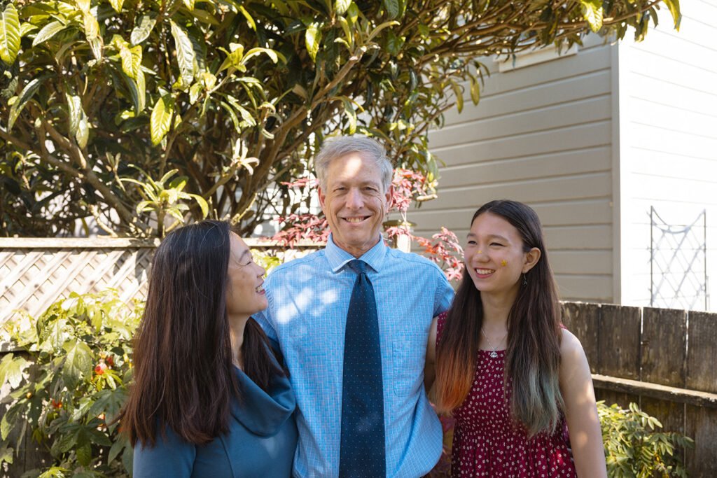 Family of three posing for their at-home family photos in San Francisco, California