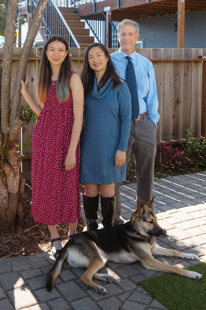 Family of three posing for their at-home family photos in San Francisco, California