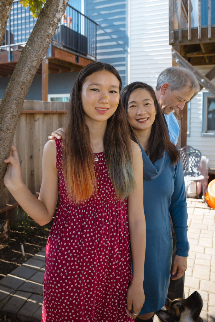 Family of three posing for their at-home family photos in San Francisco, California