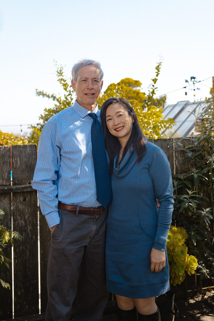 Man and woman posing for photos in their backyard in San Francisco, California