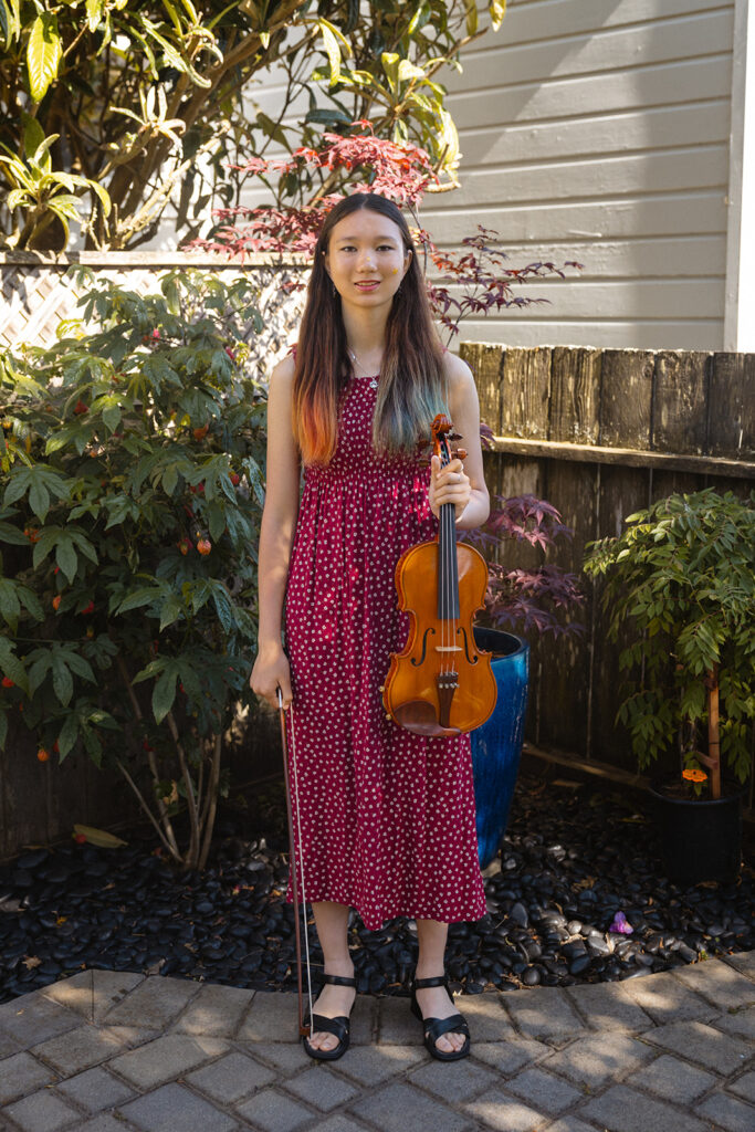 Girl holding her violin